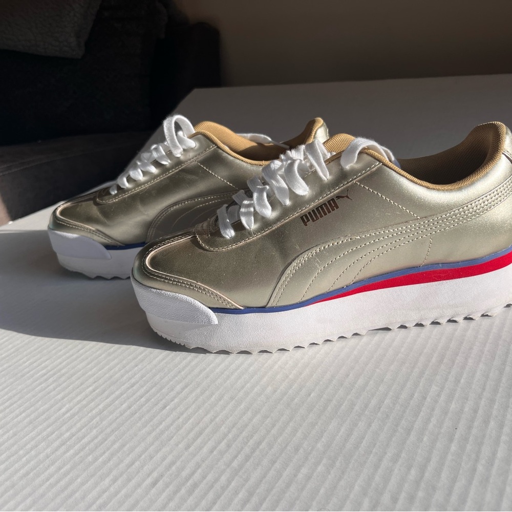 Puma Women's Gold and White Platform Sneakers
Mint condition